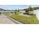 A sprawling backyard showcases hardscape walkways, a firepit, and outdoor seating, ideal for leisure and entertaining at 3087 Somerset Park Dr, Orlando, FL 32824
