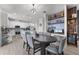 Dining area seamlessly connects the kitchen and a built-in shelving and workspace area at 3087 Somerset Park Dr, Orlando, FL 32824