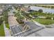 Community entrance featuring manicured landscaping, palm trees, and well-marked signage at 3087 Somerset Park Dr, Orlando, FL 32824