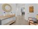 Bright, modern hallway featuring wood floors, stylish decor, and an open view into the living space at 3087 Somerset Park Dr, Orlando, FL 32824