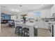 Modern kitchen boasts a large island, stainless steel appliances, and open layout at 3087 Somerset Park Dr, Orlando, FL 32824
