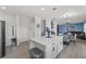 Open-concept kitchen with an island, seamlessly connected to the dining and living areas at 3087 Somerset Park Dr, Orlando, FL 32824