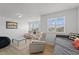 Bright living room with plush seating, natural light, and a contemporary design at 3087 Somerset Park Dr, Orlando, FL 32824