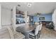 Open-concept living and dining area with modern finishes and comfortable seating at 3087 Somerset Park Dr, Orlando, FL 32824