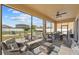 The covered outdoor patio features a ceiling fan and comfortable seating for relaxing and entertaining at 3087 Somerset Park Dr, Orlando, FL 32824