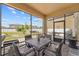 Outdoor patio featuring stone flooring, a gas grill, and an outdoor dining table set with seating for four at 3087 Somerset Park Dr, Orlando, FL 32824