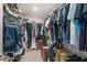 Spacious walk-in closet with ample storage, hanging racks, and shelving at 3087 Somerset Park Dr, Orlando, FL 32824