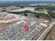 Expansive aerial view of a modern residential community featuring numerous homes and neighborhood amenities at 3954 Great Smokey Way, Apopka, FL 32712