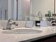 Close-up of bathroom sink with chrome faucet and white countertop at 3954 Great Smokey Way, Apopka, FL 32712