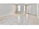 Bright, empty room with tile floors, large windows, and a neutral color palette at 3954 Great Smokey Way, Apopka, FL 32712