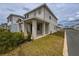 Charming home features a covered porch, well-maintained landscaping, and a neatly manicured lawn at 3954 Great Smokey Way, Apopka, FL 32712