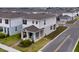 Aerial view of a beautifully designed two-story home with well-kept lawns and landscaping at 3954 Great Smokey Way, Apopka, FL 32712