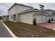 Corner lot home showcases a two-car garage and manicured lawn, accented by the street sign for Happy Canyon at 3954 Great Smokey Way, Apopka, FL 32712