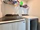 Modern laundry machines with shelving at 3954 Great Smokey Way, Apopka, FL 32712
