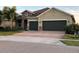 Charming single-story home with a paved driveway and a well-manicured front yard at 4036 Parkhouse Dr, Orlando, FL 32824