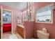 The bathroom features a wood vanity and a separate toilet room, offering privacy and convenience at 420 Wild Oak Cir, Longwood, FL 32779