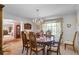 Formal dining room featuring an elegant chandelier, classic furnishings, and natural light at 420 Wild Oak Cir, Longwood, FL 32779