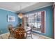 Cozy dining room with a window overlooking the pool area, filled with natural light at 420 Wild Oak Cir, Longwood, FL 32779