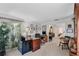 Spacious home office with well-lit desks, offering an organized workspace and access to the primary bedroom at 420 Wild Oak Cir, Longwood, FL 32779