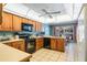 Functional kitchen with wooden cabinets, appliances and a connecting breakfast nook at 420 Wild Oak Cir, Longwood, FL 32779