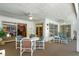 Screened lanai with dining table, lounge chairs, and sliding doors to the home at 420 Wild Oak Cir, Longwood, FL 32779