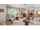 Bright living room with large window and floral accents, creating a cozy and inviting atmosphere at 420 Wild Oak Cir, Longwood, FL 32779