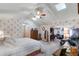Spacious main bedroom with decorative wallpaper and a vaulted ceiling with skylights at 420 Wild Oak Cir, Longwood, FL 32779