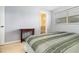 Cozy bedroom with a table, carpet, and view into the bathroom at 4231 Yorketowne Rd, Orlando, FL 32812