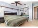 Comfortable bedroom featuring a ceiling fan, carpet, and a large mirrored closet at 4231 Yorketowne Rd, Orlando, FL 32812