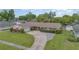 Lovely single-story home featuring a large driveway and well-manicured lawn at 4231 Yorketowne Rd, Orlando, FL 32812