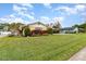Quaint home with a lush lawn and mature landscaping at 4231 Yorketowne Rd, Orlando, FL 32812