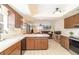 Functional kitchen with tile flooring, wooden cabinets, and an open layout at 4231 Yorketowne Rd, Orlando, FL 32812