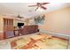 Living room showcasing a sofa, nautical decor, and flooring transitioning to another room at 4231 Yorketowne Rd, Orlando, FL 32812