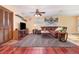 Comfortable living room featuring a large sofa, ceiling fan, carpet flooring, and nautical decor at 4231 Yorketowne Rd, Orlando, FL 32812