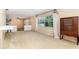 Large room with carpet flooring, a window with curtains, and neutral paint at 4231 Yorketowne Rd, Orlando, FL 32812