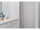 Bright bathroom with double sinks, modern fixtures, and a view of the adjacent shower at 4316 Carrabelle River Ln, Lakeland, FL 33811