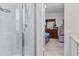 Modern bathroom featuring a glass-enclosed shower with tiled walls and a view into the bedroom at 4316 Carrabelle River Ln, Lakeland, FL 33811