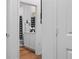 View of a well-lit bathroom with neutral tones and a decorative shower curtain at 4316 Carrabelle River Ln, Lakeland, FL 33811
