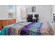Bedroom featuring a black metal frame bed and a decorative bedspread at 4316 Carrabelle River Ln, Lakeland, FL 33811
