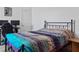 Bedroom featuring a black metal frame bed and a decorative bedspread at 4316 Carrabelle River Ln, Lakeland, FL 33811