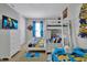 A bright bedroom showcasing a white bunk bed with Minion-themed decor, complemented by matching TV and dresser at 4500 Alberto Cir, Kissimmee, FL 34746