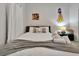 Comfortable bedroom with soft lighting, cartoon posters, and plush pillows for a relaxing atmosphere at 4500 Alberto Cir, Kissimmee, FL 34746