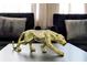 Modern gold leopard statue sitting on a table in a room with neutral colors at 4500 Alberto Cir, Kissimmee, FL 34746