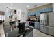 Open concept kitchen with granite countertops and stainless steel appliances at 4500 Alberto Cir, Kissimmee, FL 34746