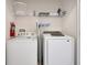 Convenient laundry area with washer, dryer, shelving, and fire extinguisher at 4500 Alberto Cir, Kissimmee, FL 34746