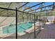 Enclosed pool area with a safety fence, creating a private and secure outdoor oasis at 4500 Alberto Cir, Kissimmee, FL 34746