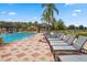 Community pool area with lounge chairs and cabanas, perfect for relaxation and recreation at 4500 Alberto Cir, Kissimmee, FL 34746