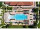 Aerial view of a resort style pool with lounge chairs and decorative fountain at 4500 Alberto Cir, Kissimmee, FL 34746