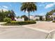 The Enclaves Amenity Center features lush landscaping, palm trees, and beautiful buildings at 482 Captiva Dr, Davenport, FL 33836