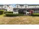 The backyard patio features a screened-in area for outdoor enjoyment at 482 Captiva Dr, Davenport, FL 33836